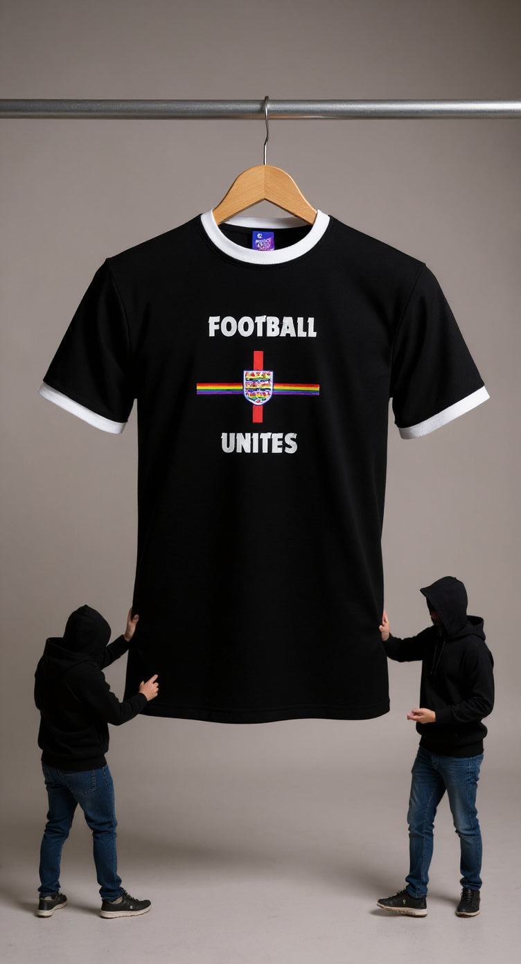 Pride Black t-shirt with 'Football Unites' text and rainbow design on a hanger, two people holding the shirt for scale.