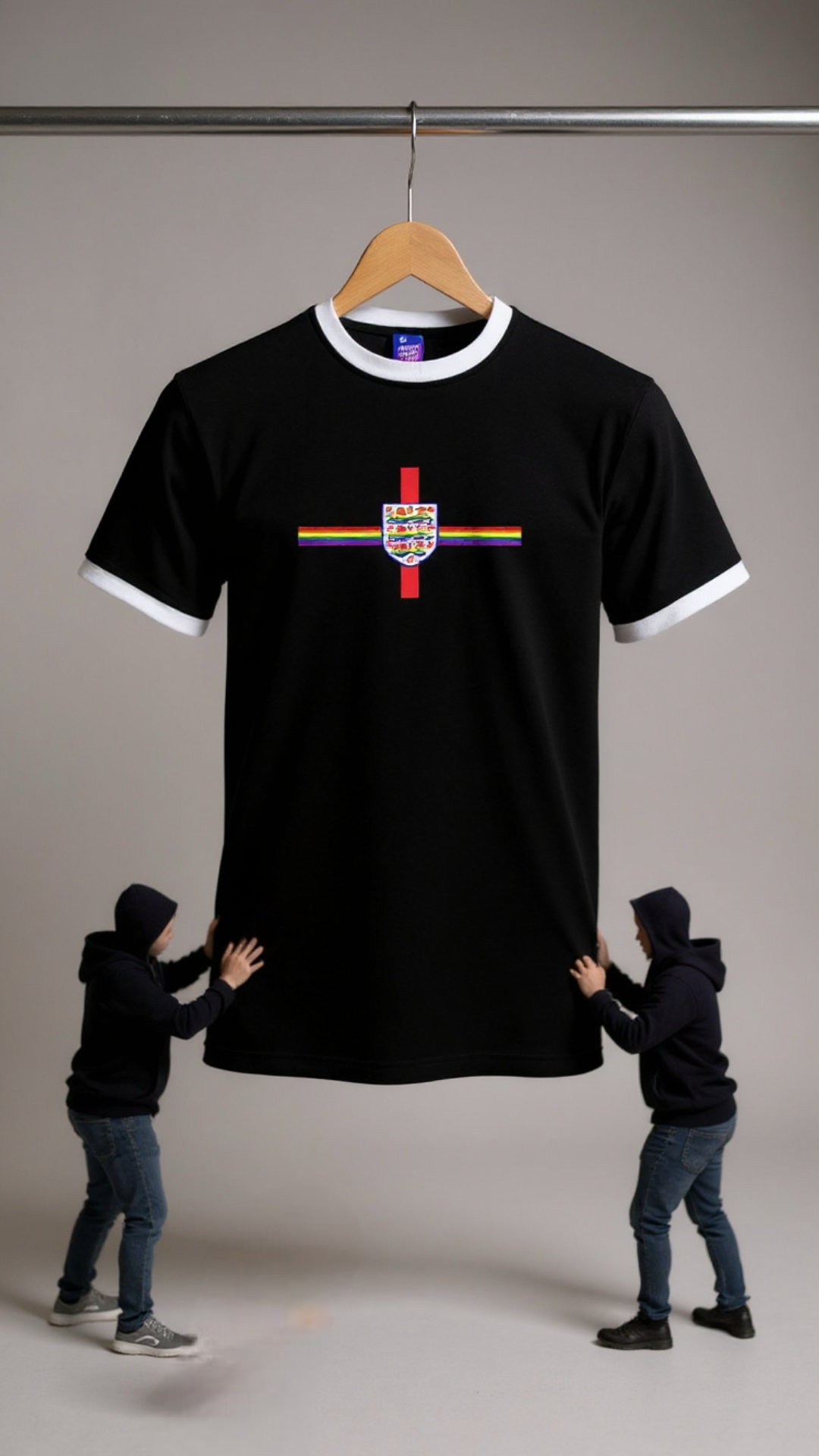 Pride Black t-shirt with a colourful logo on a hanger, held up by two people against a plain background