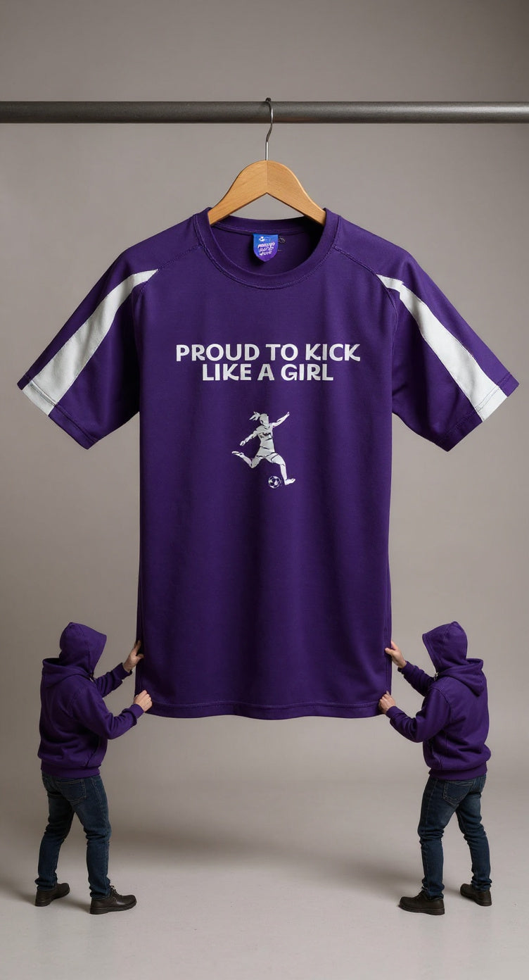 Purple t-shirt with 'PROUD TO KICK LIKE A GIRL' text and graphic on a hanger