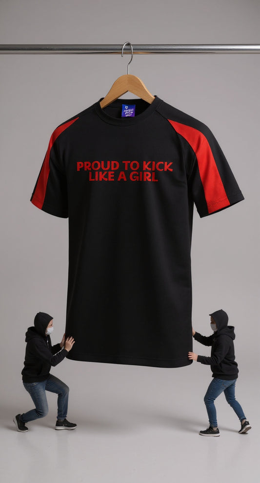 Black t-shirt with red text on a hanger, pushed by two people against a neutral background