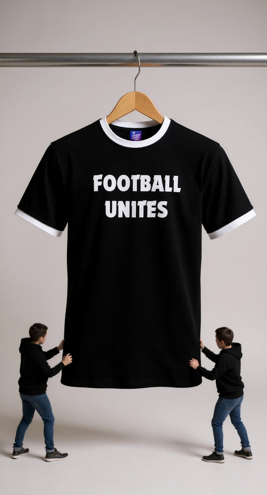 Black t-shirt with 'FOOTBALL UNITES' text on a hanger, two people holding it